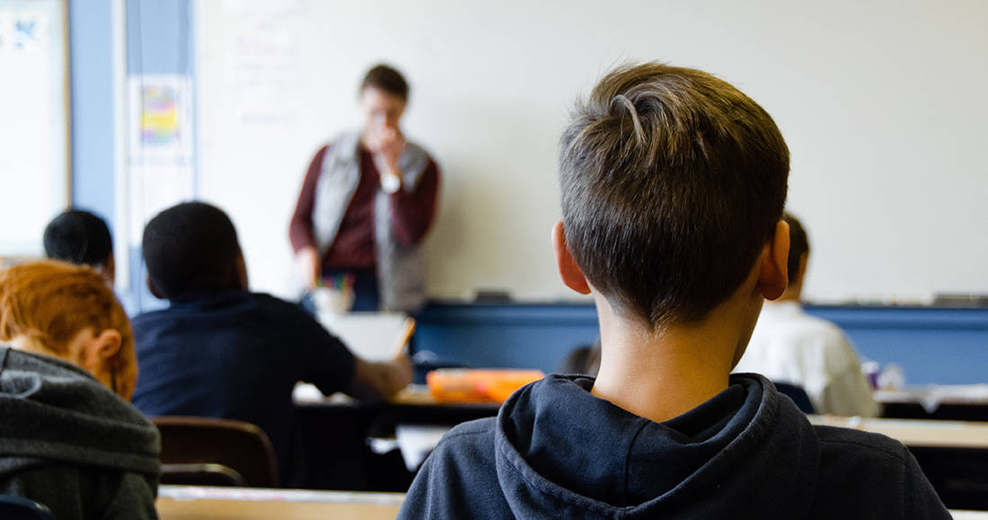 student sits in classroom